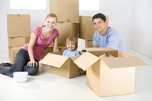 Van and movers assisting with a residential move