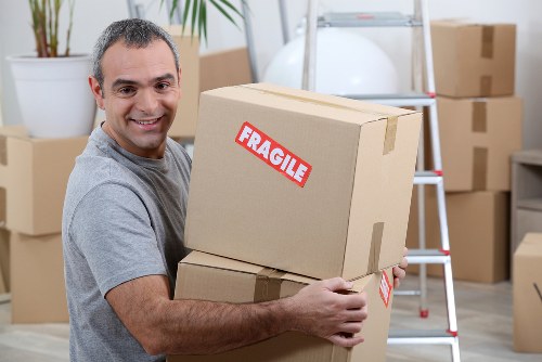 Man with van unloading items at a new location