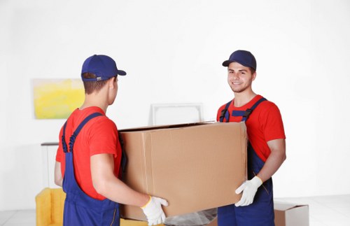 Trained removal staff using equipment and wearing PPE during a move