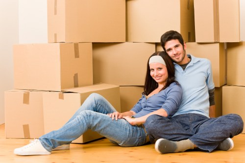 Happy family settling into their new home with furniture