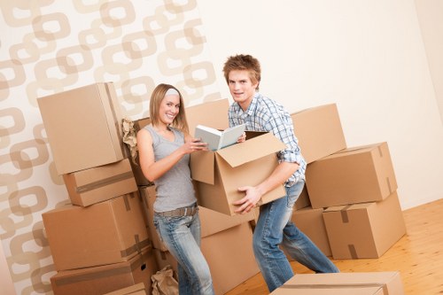 Man with van loading furniture into the vehicle