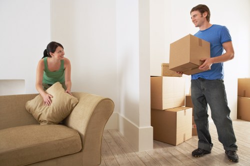 Removalists loading furniture into a moving truck
